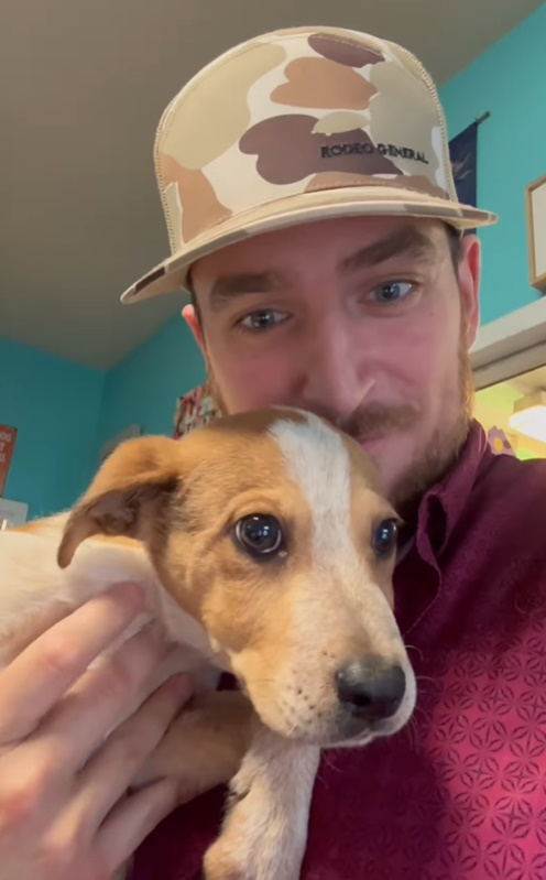man and a puppy