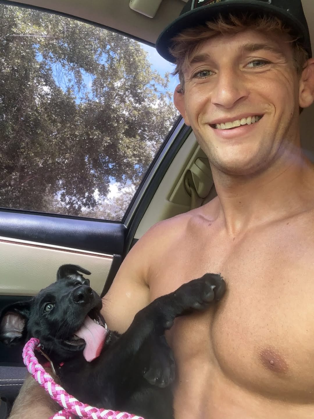 man and sweet black dog