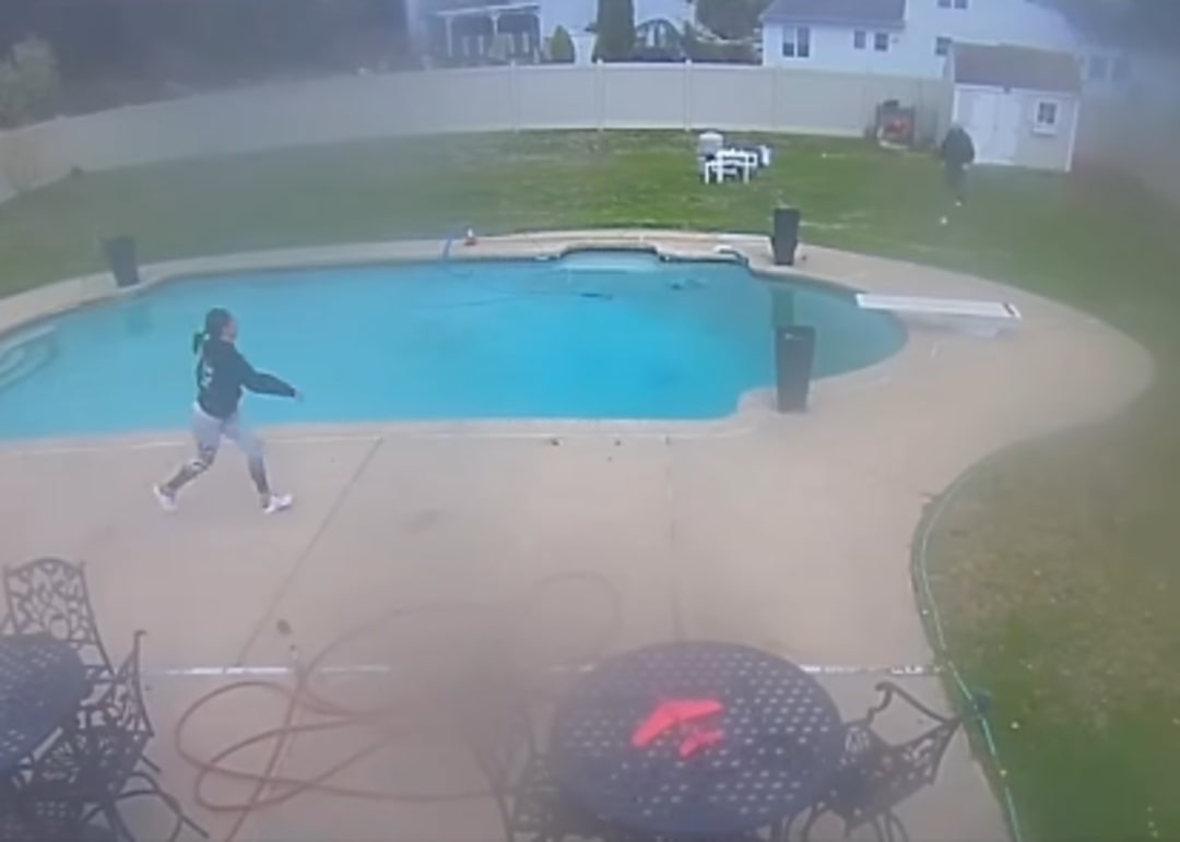 owner running near pool