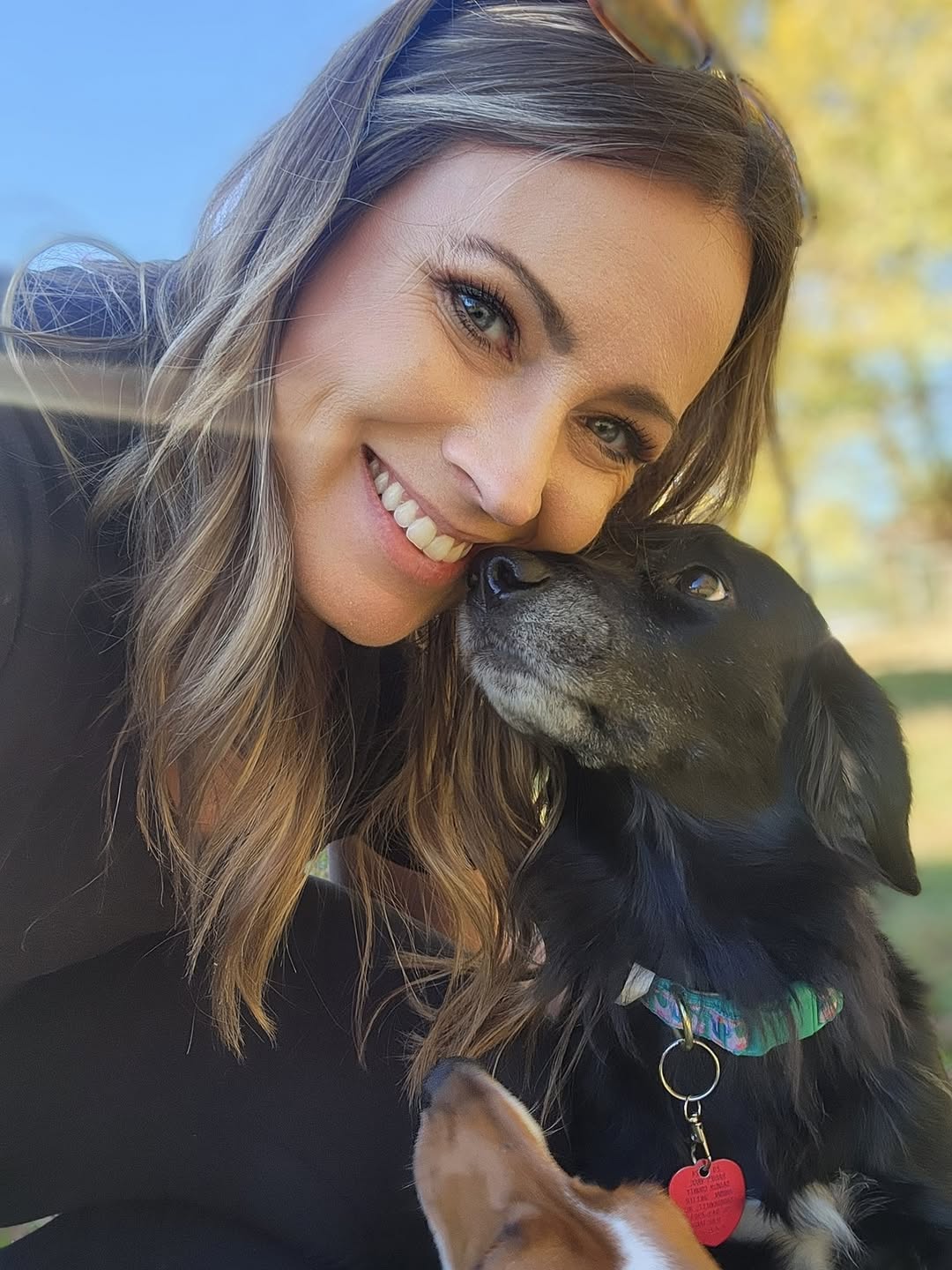 woman and black dog