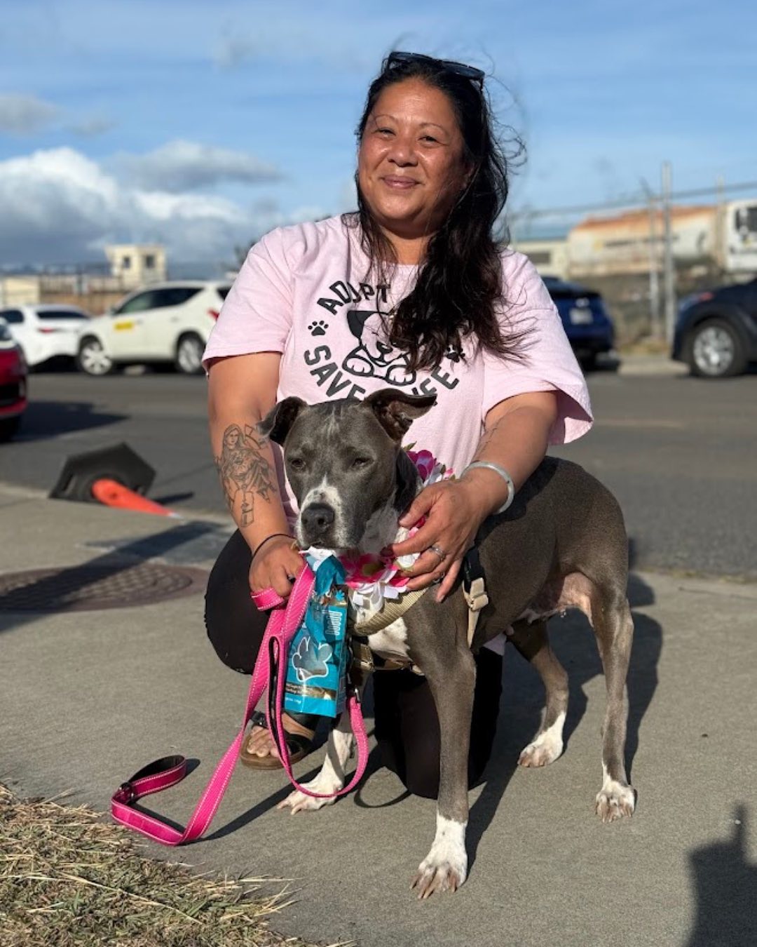 woman and black dog posing for picture