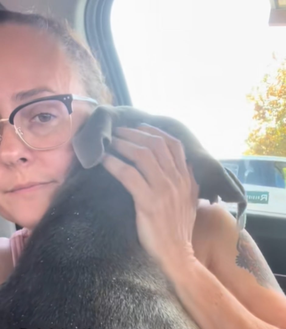 woman hugging a dog