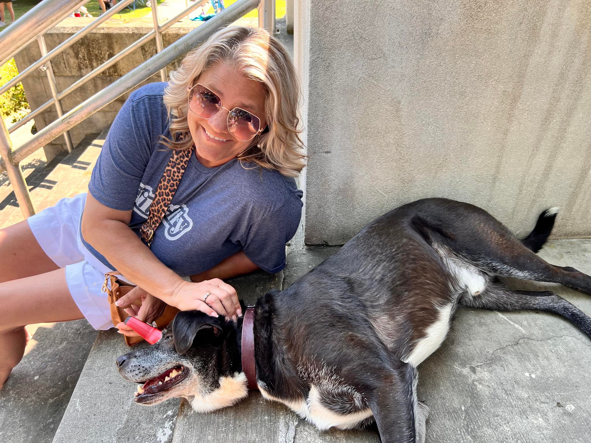 woman petting the dog