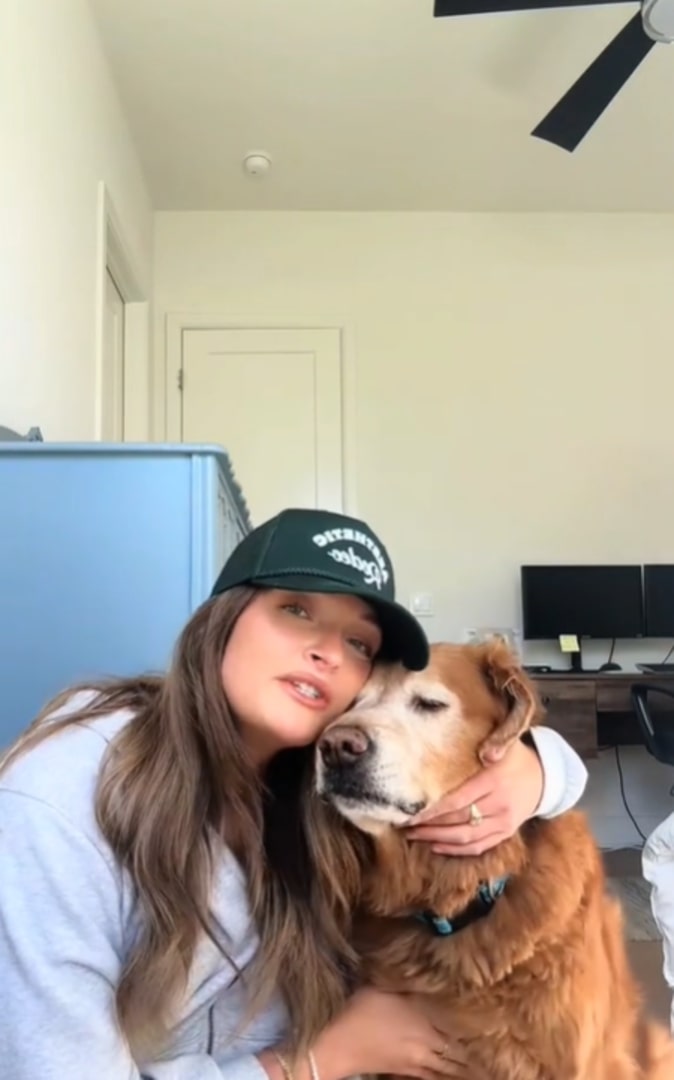 young woman hugging a dog