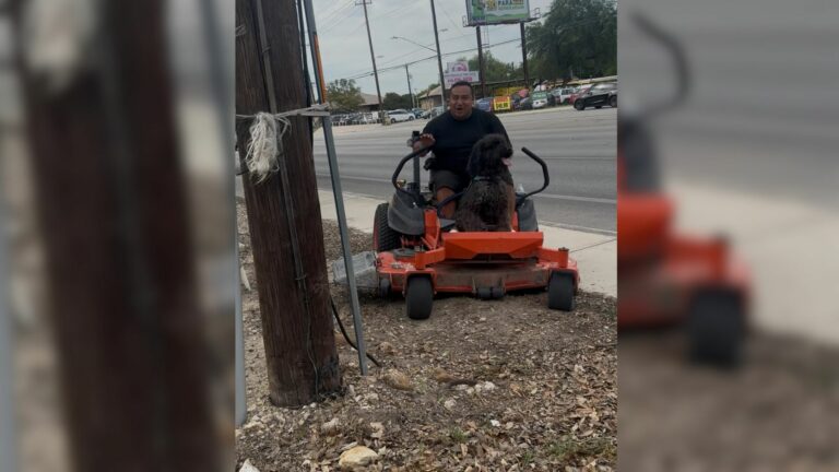 man on lawnmower
