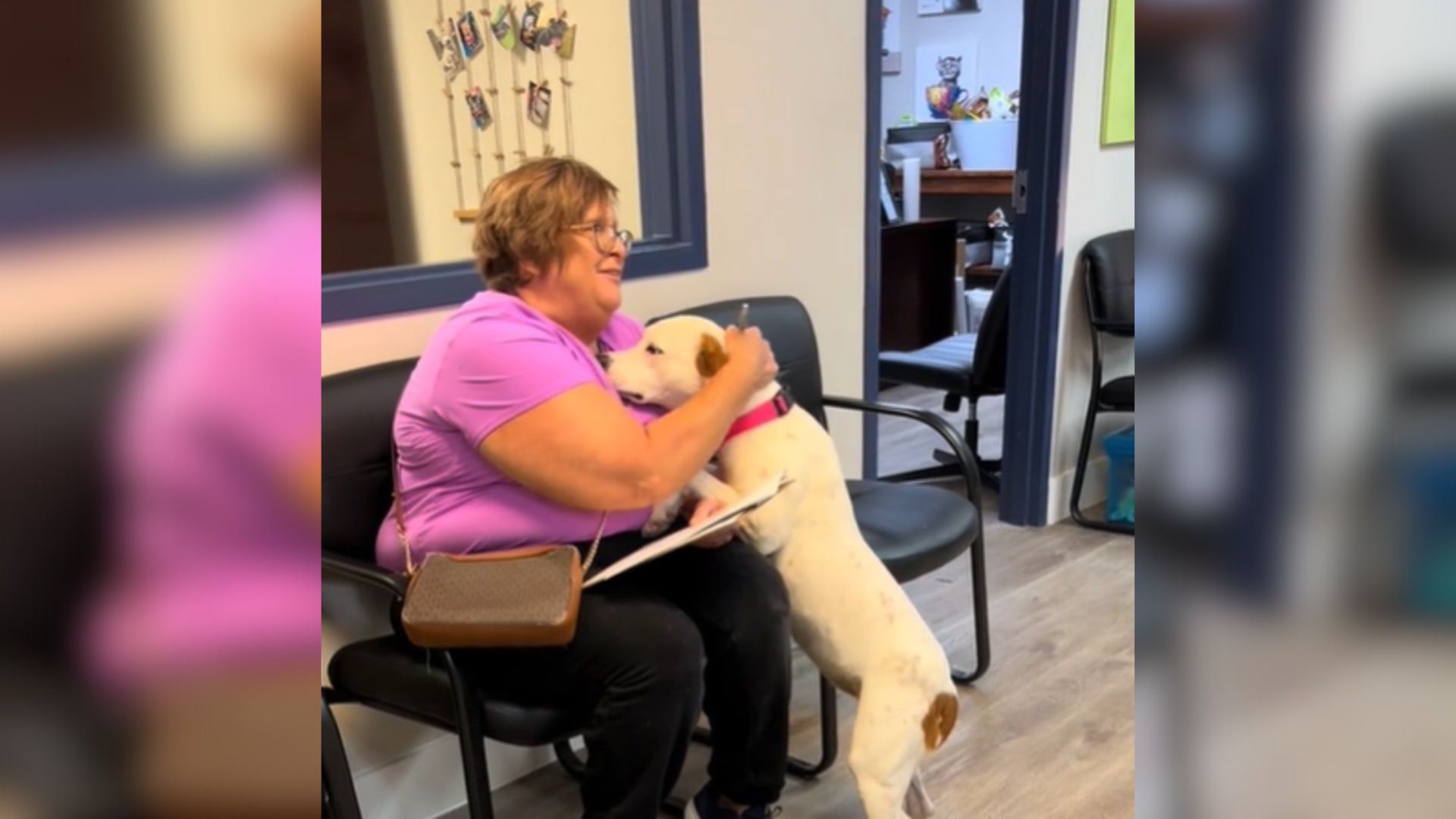 dog gives woman a hug