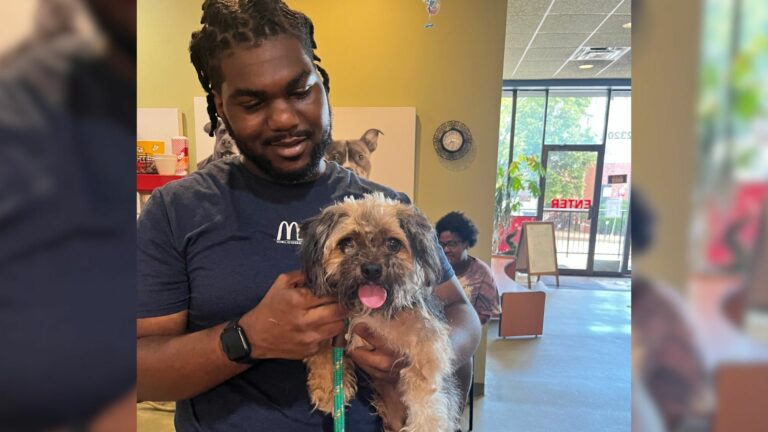 man holding a dog