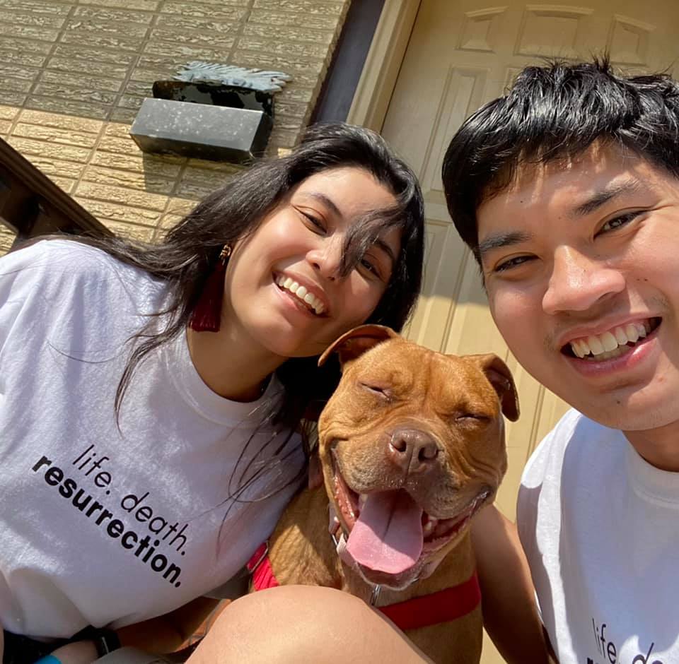 couple and adopted dog