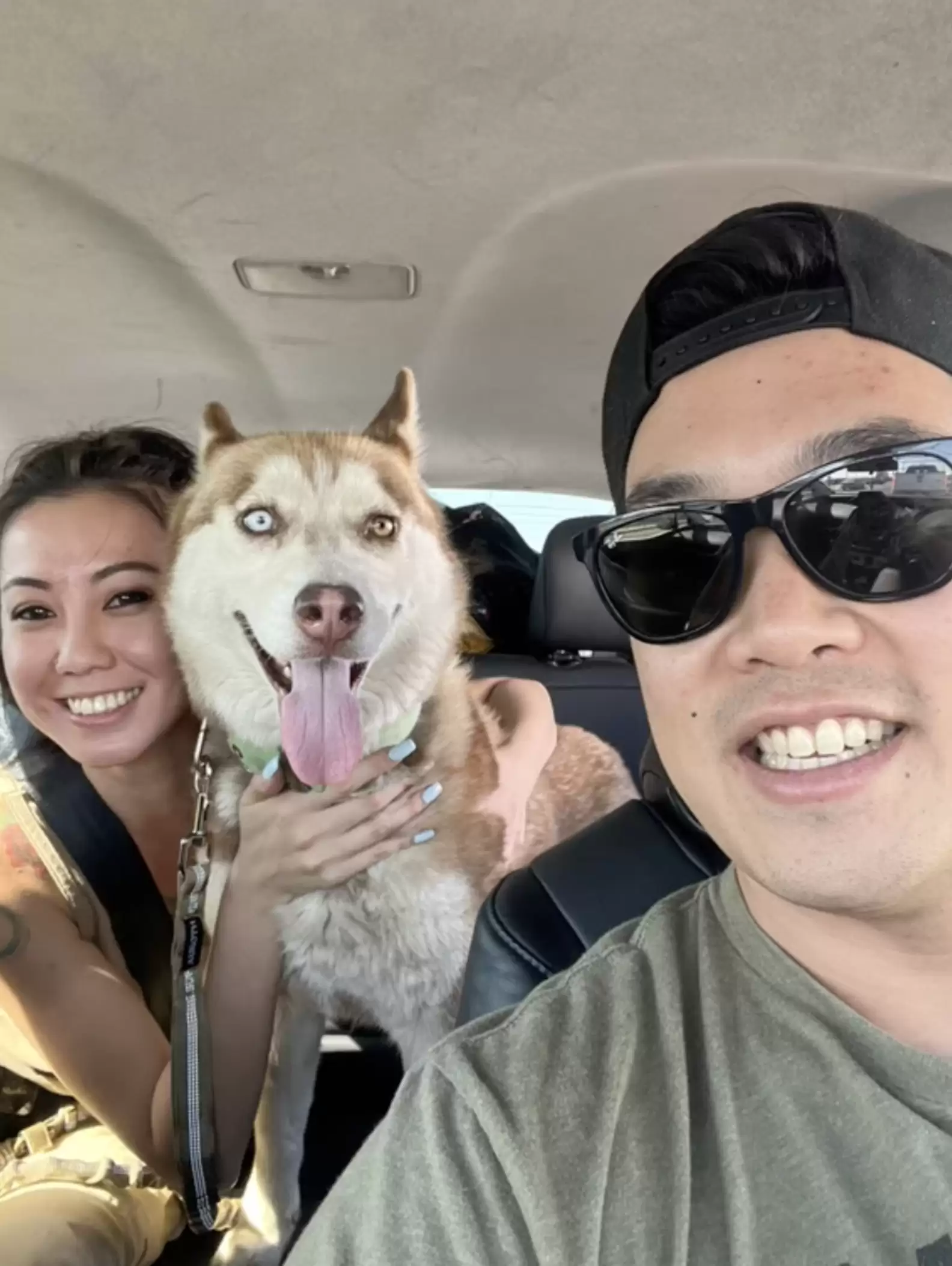 couple and dog in car
