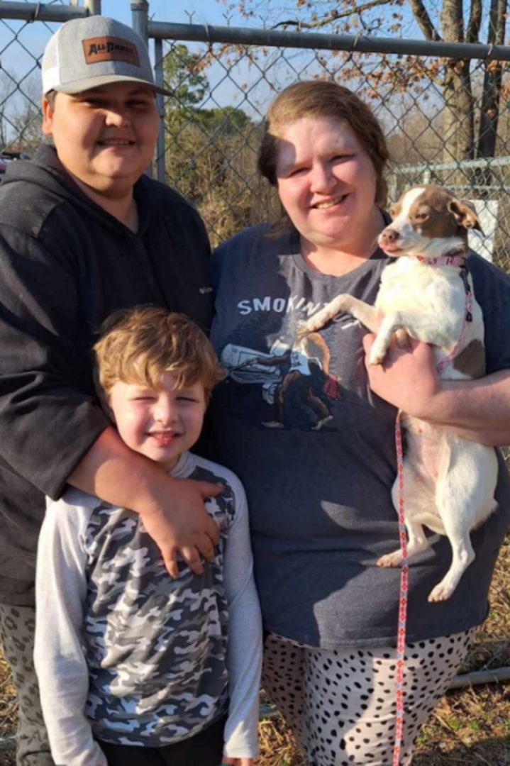 family of three and dog