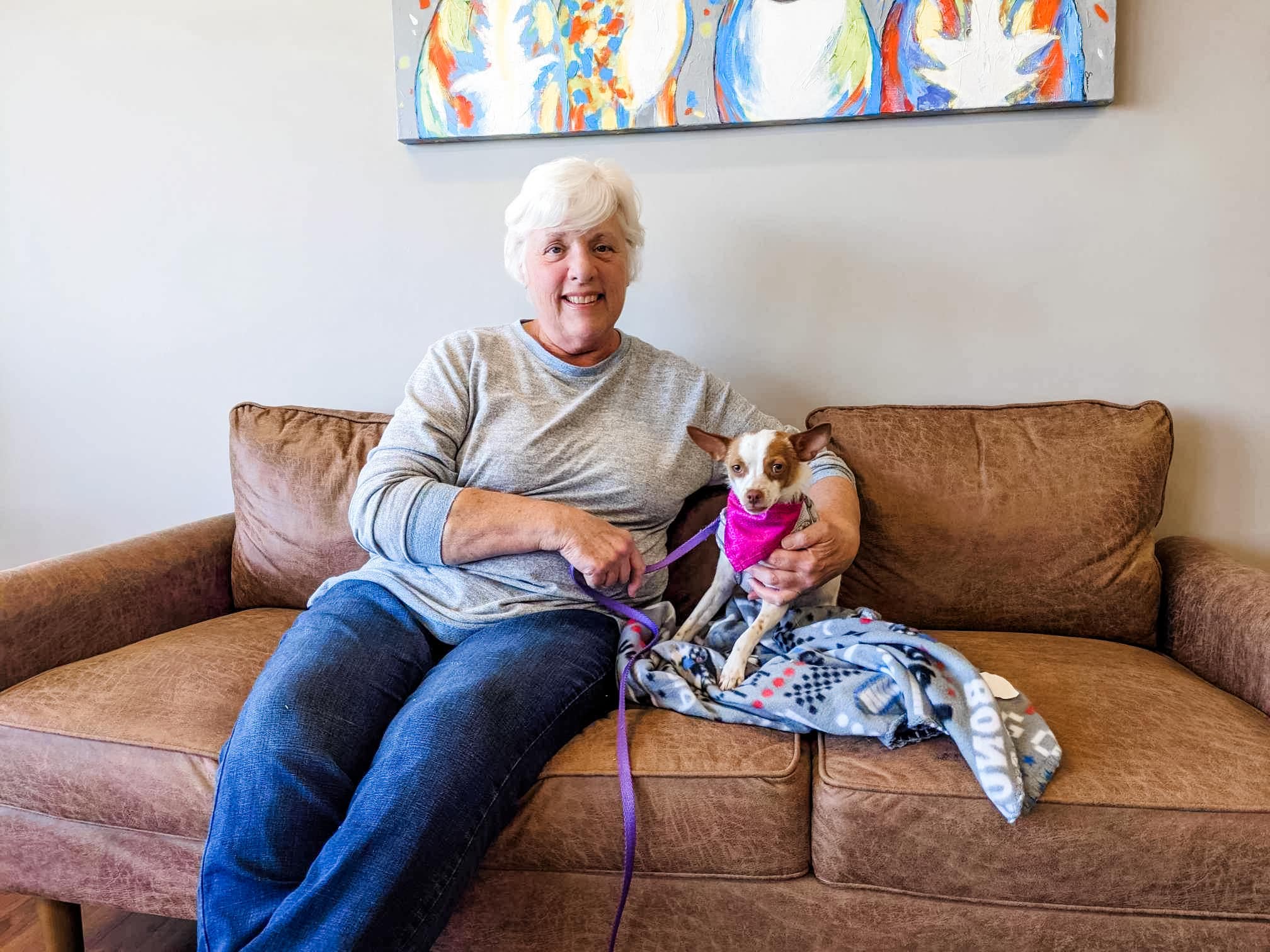 little dog and her human sitting on couch