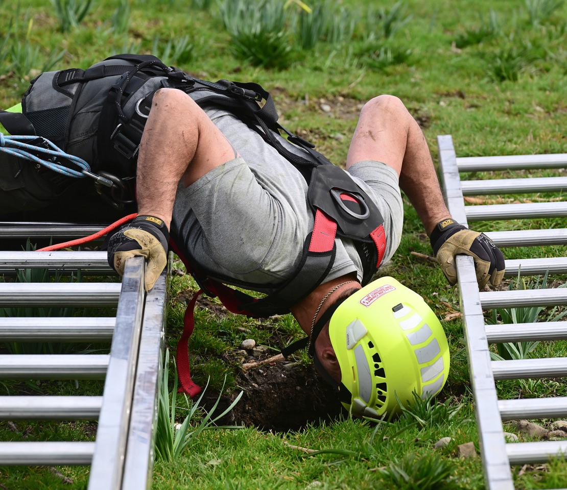 man checking a hole