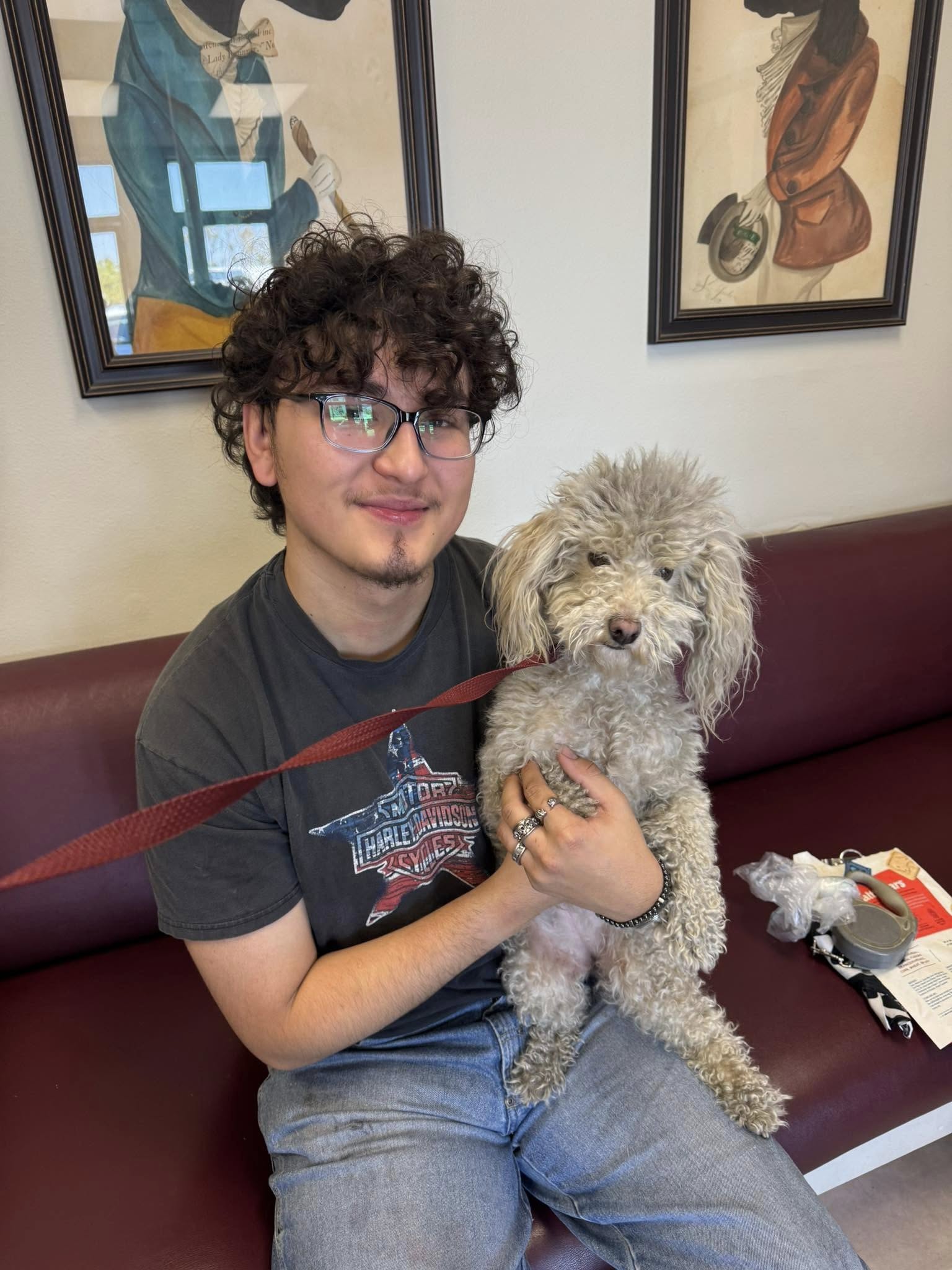 man holding a white dog