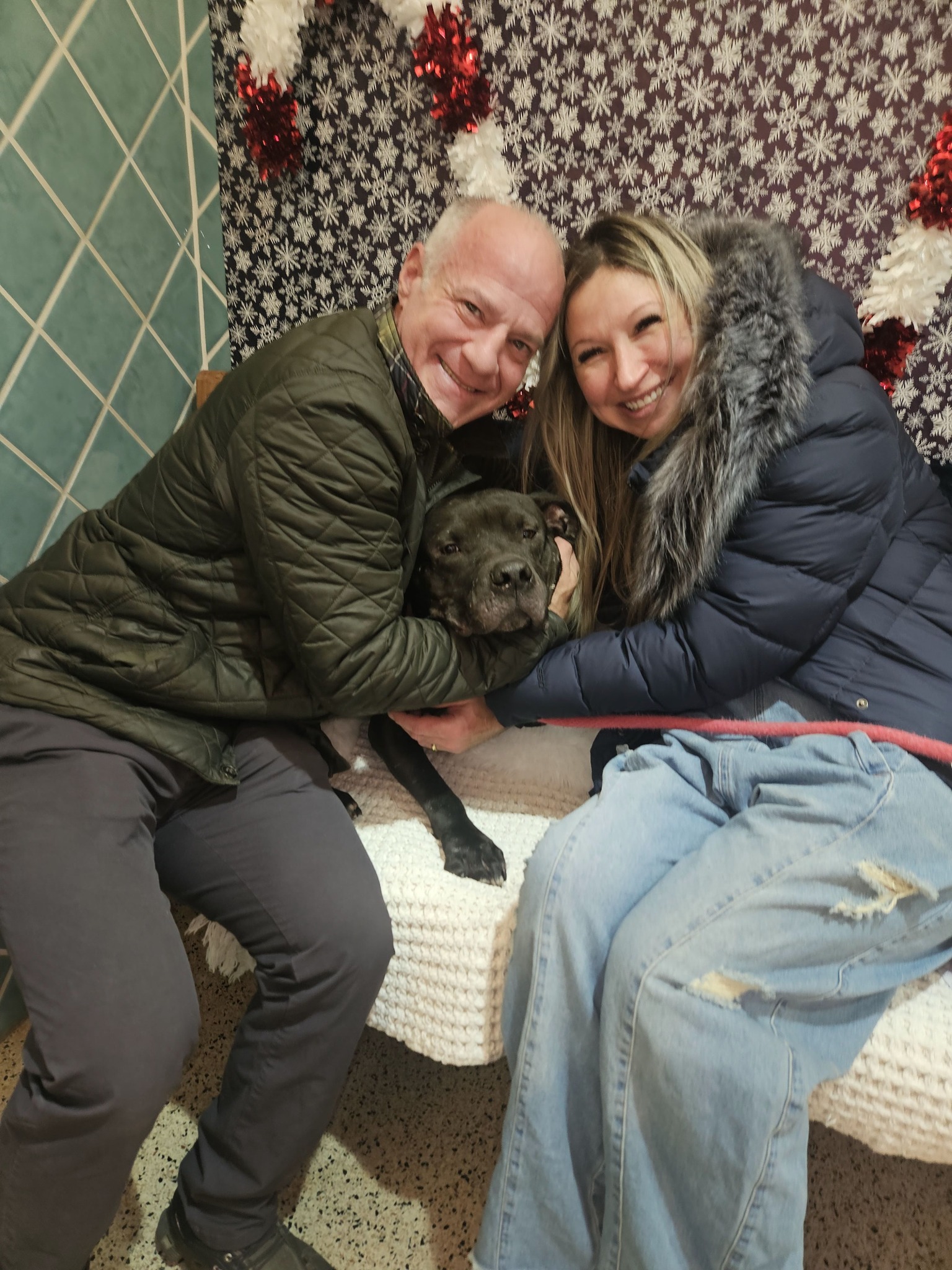 old couple and black dog