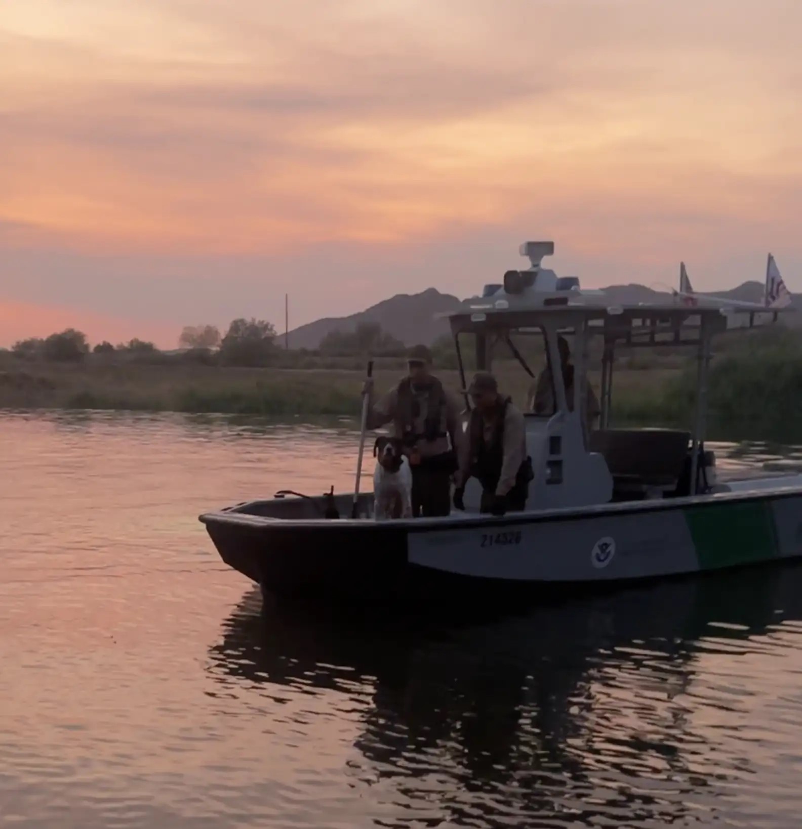 people and dog in boat