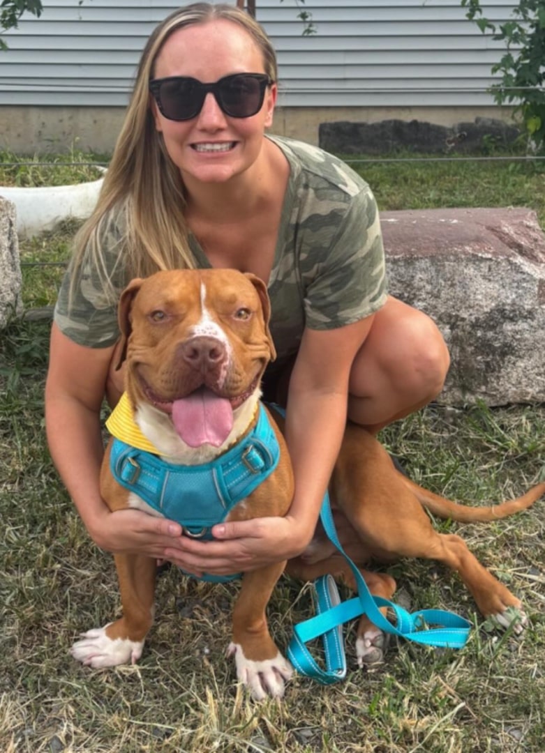 woman and brown dog