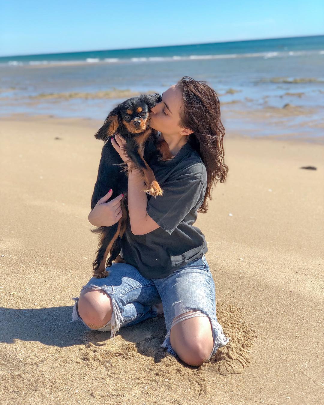 woman and dog on beach