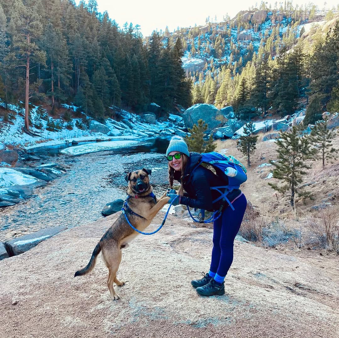 woman and dog posing for picture