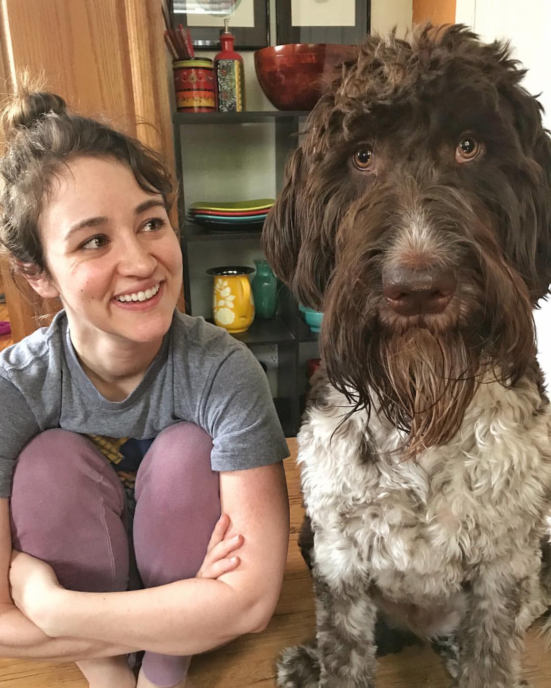 woman and dog sitting together
