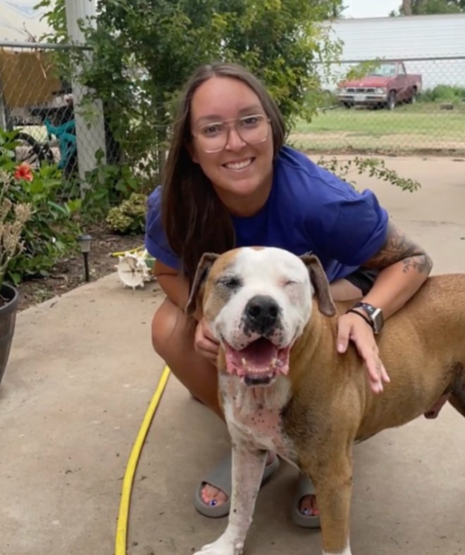 woman and very old dog