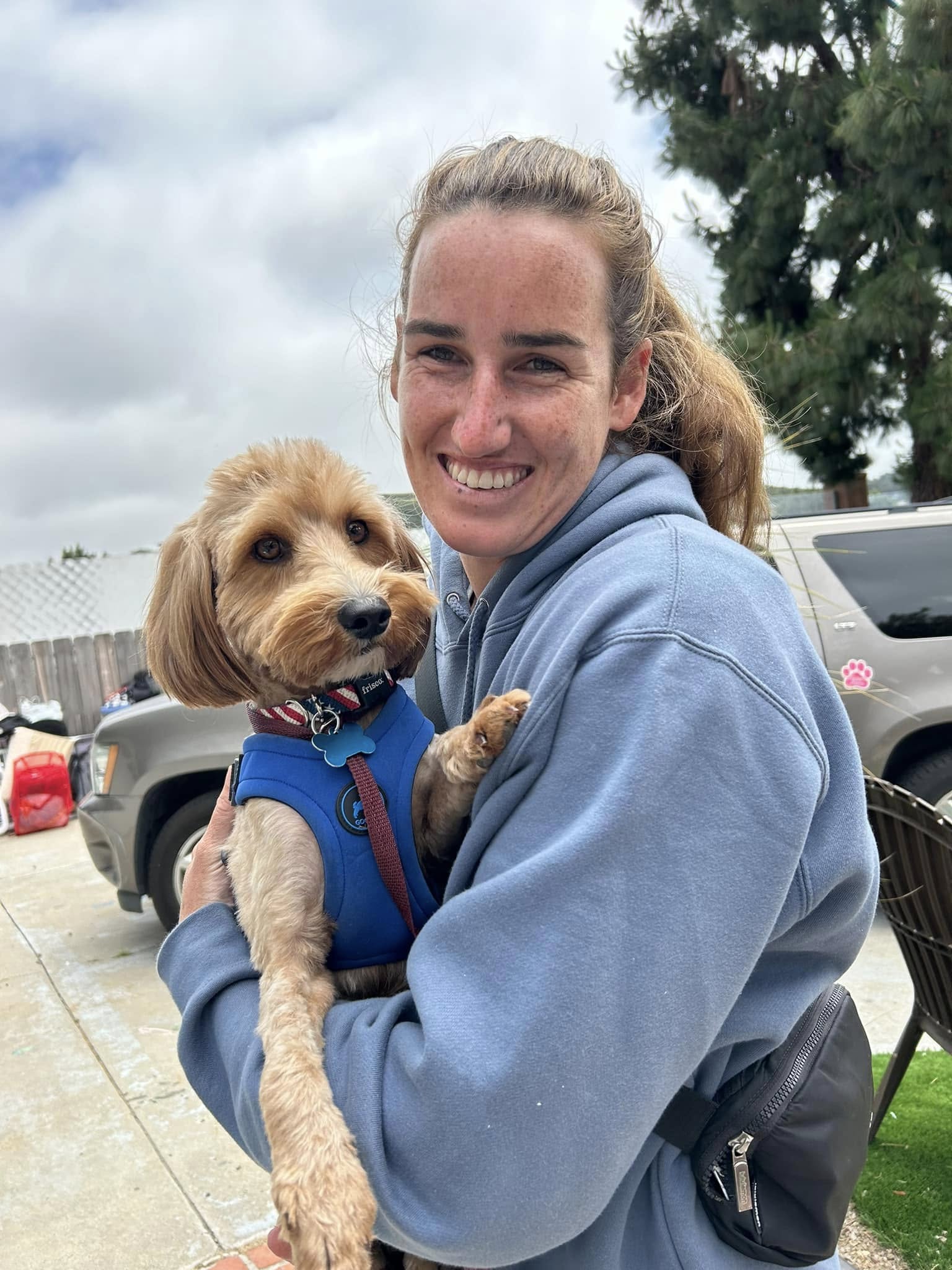 woman holding a dog