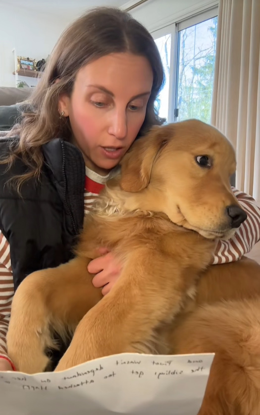 woman holding a dog