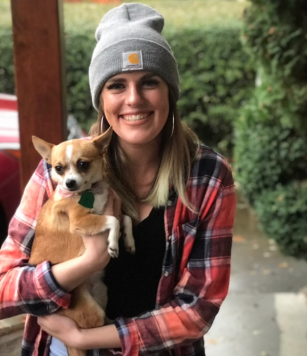 woman holding a dog