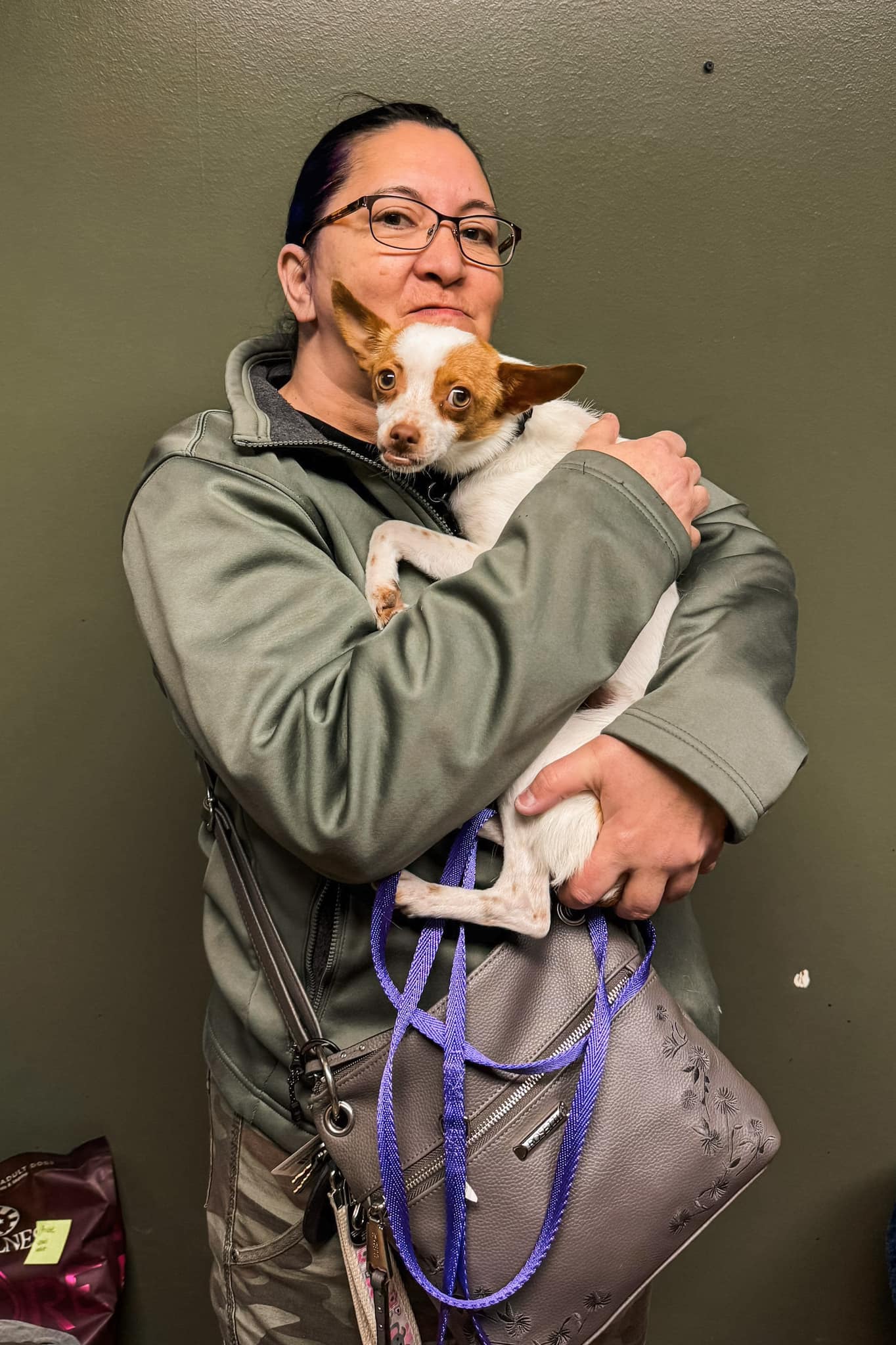 woman holding a sweet puppy