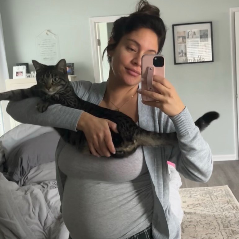 woman holding a tiny cat