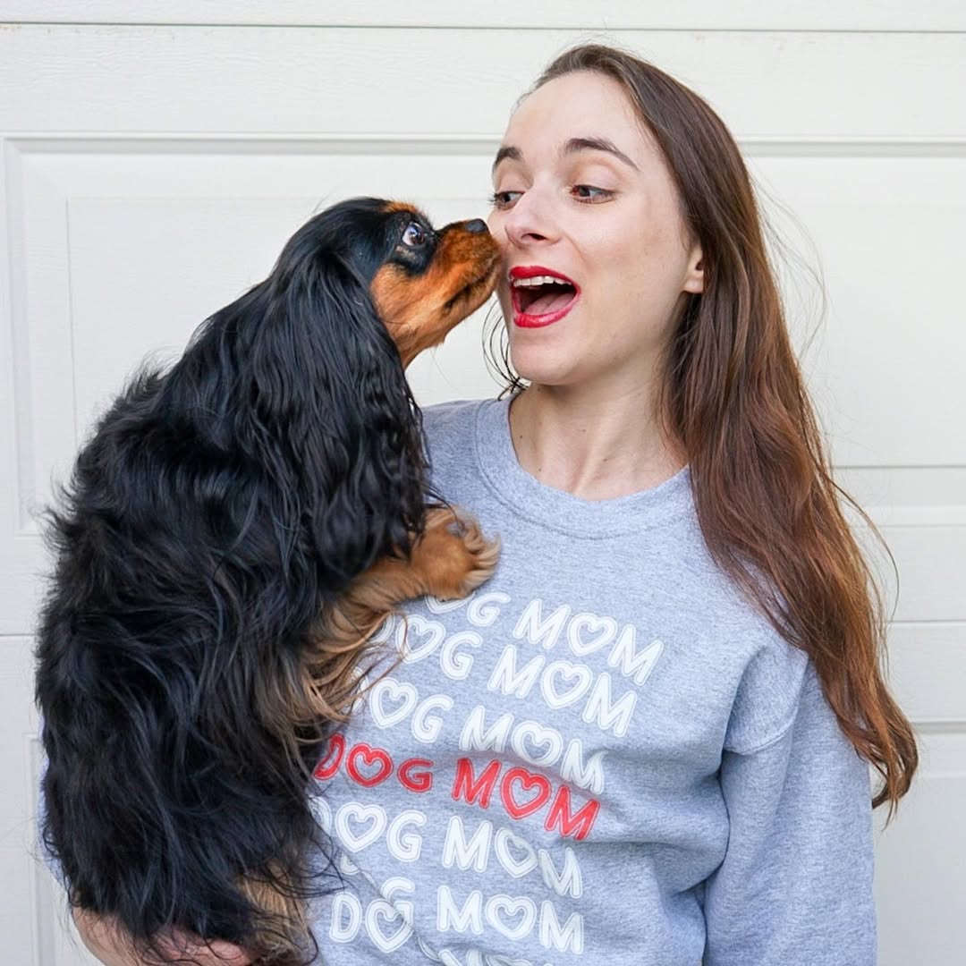 woman holding her dog