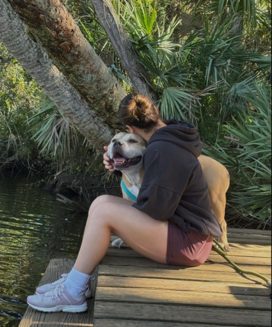 woman hugging her dog