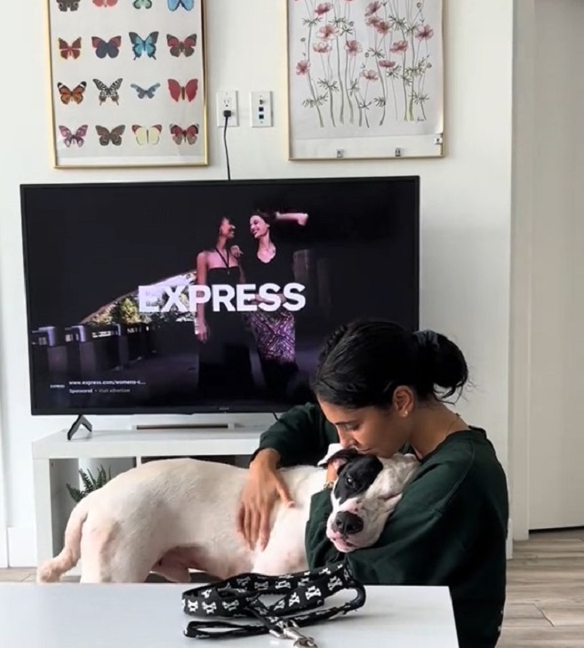 woman playing with dog
