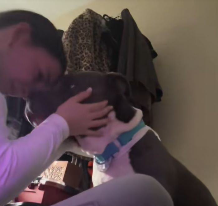 woman with dog crying