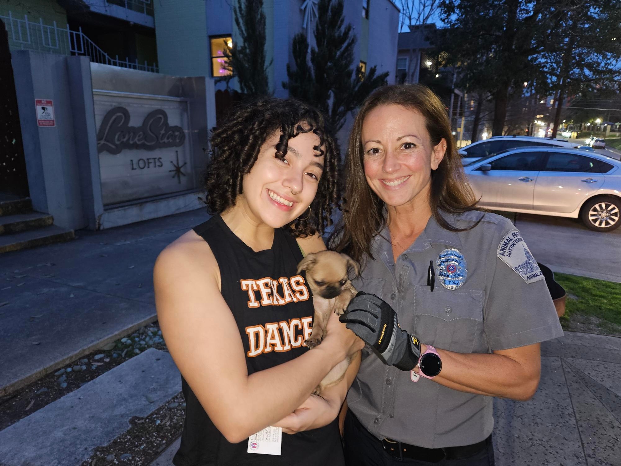 women and tiny puppy