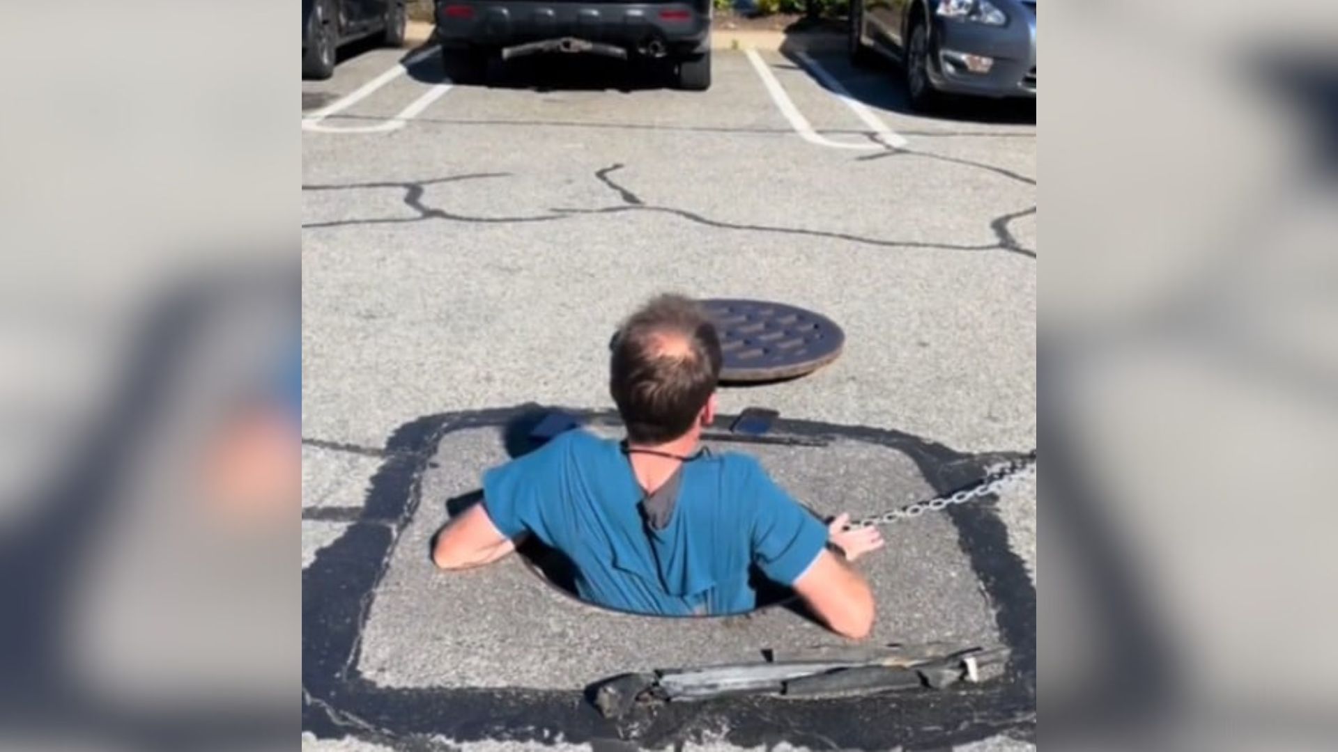 man going into a deep hole to rescue an animal