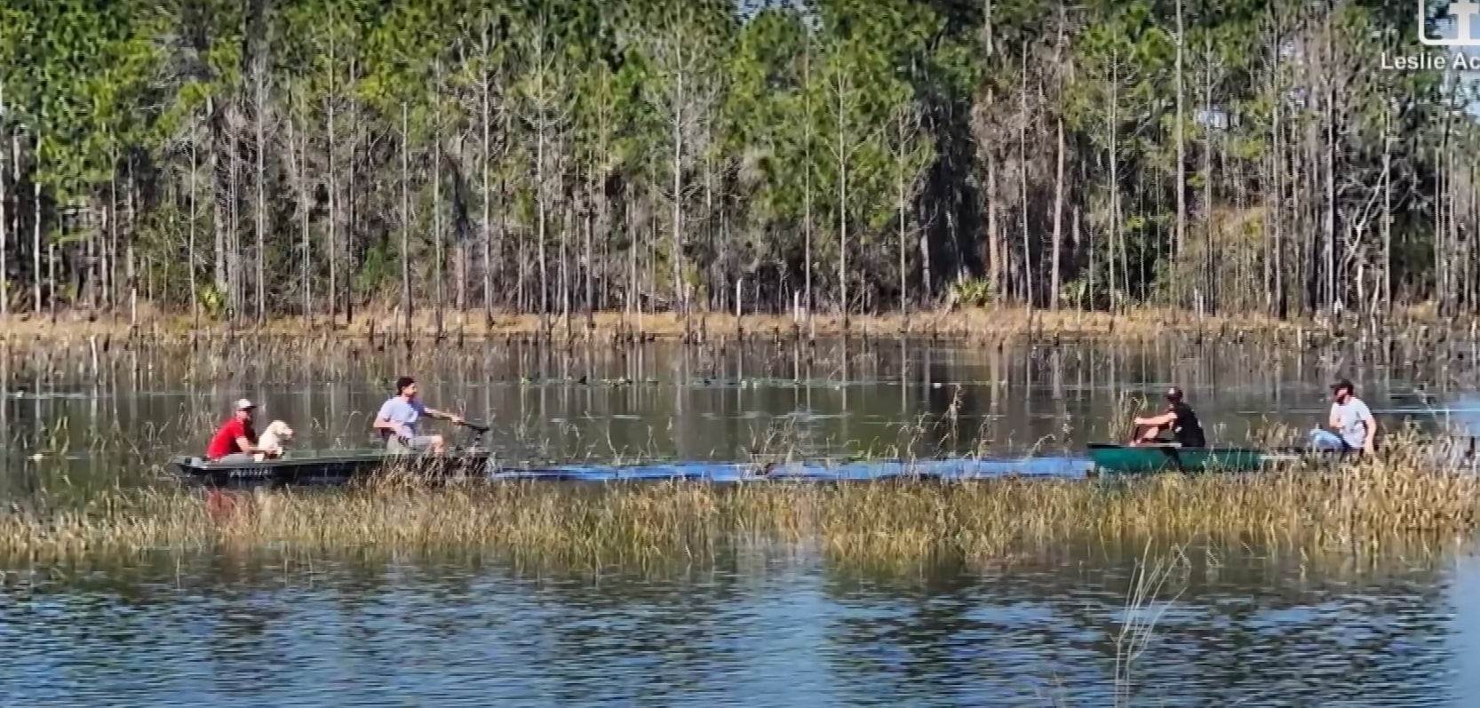family spots dog in lake