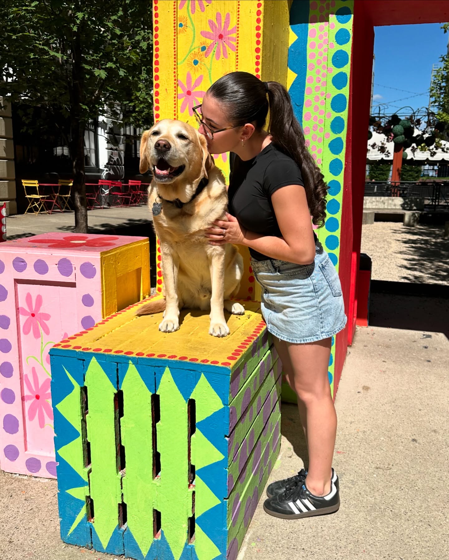 girl kissing a dog