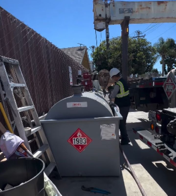 man and fuel tank
