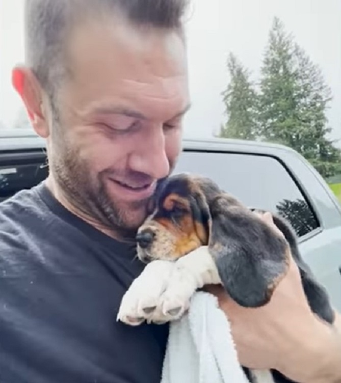 man holding a dog