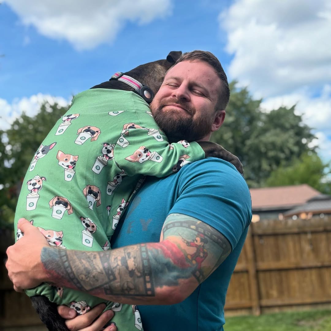 man holding a dog