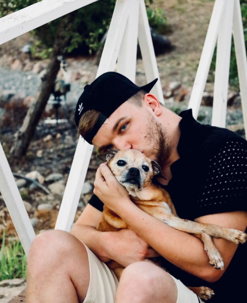 man kissing a dog