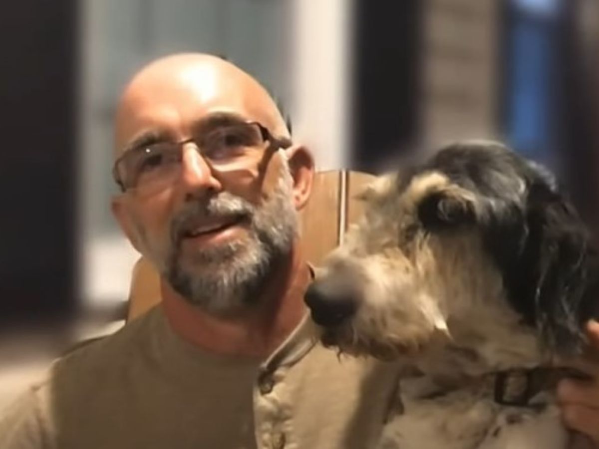 man with glasses and a dog