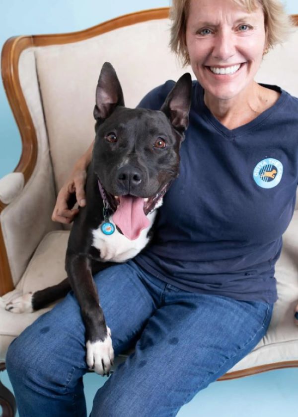 old woman and black dog