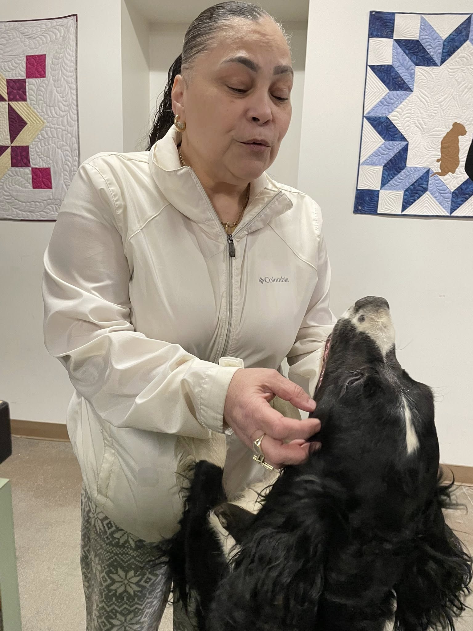 old woman and black dog