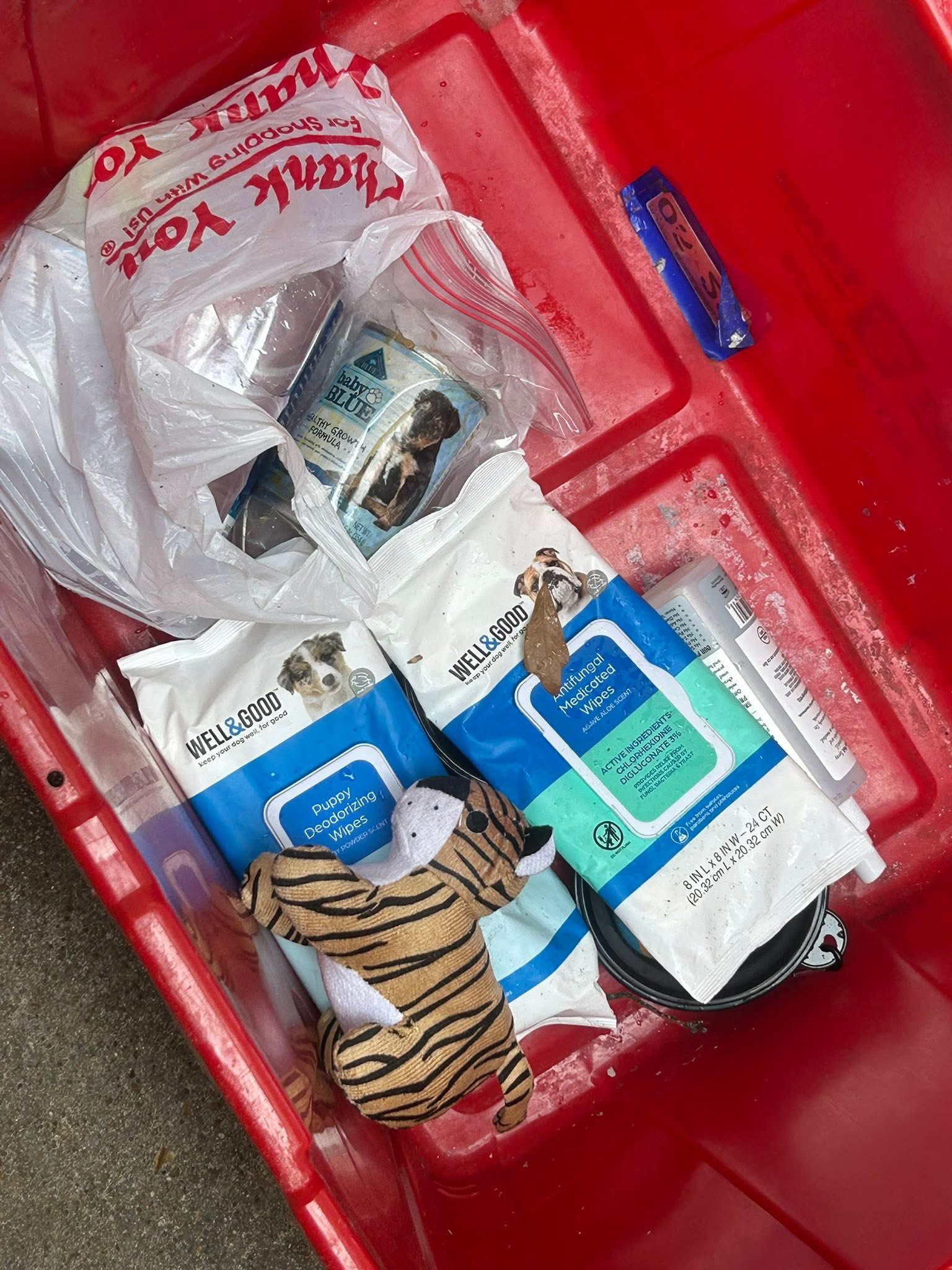 staff in red bin