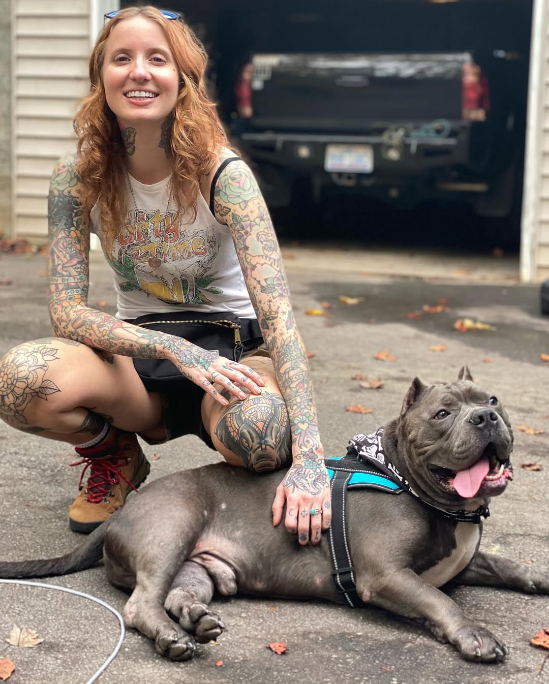 tattooed woman and fat dog