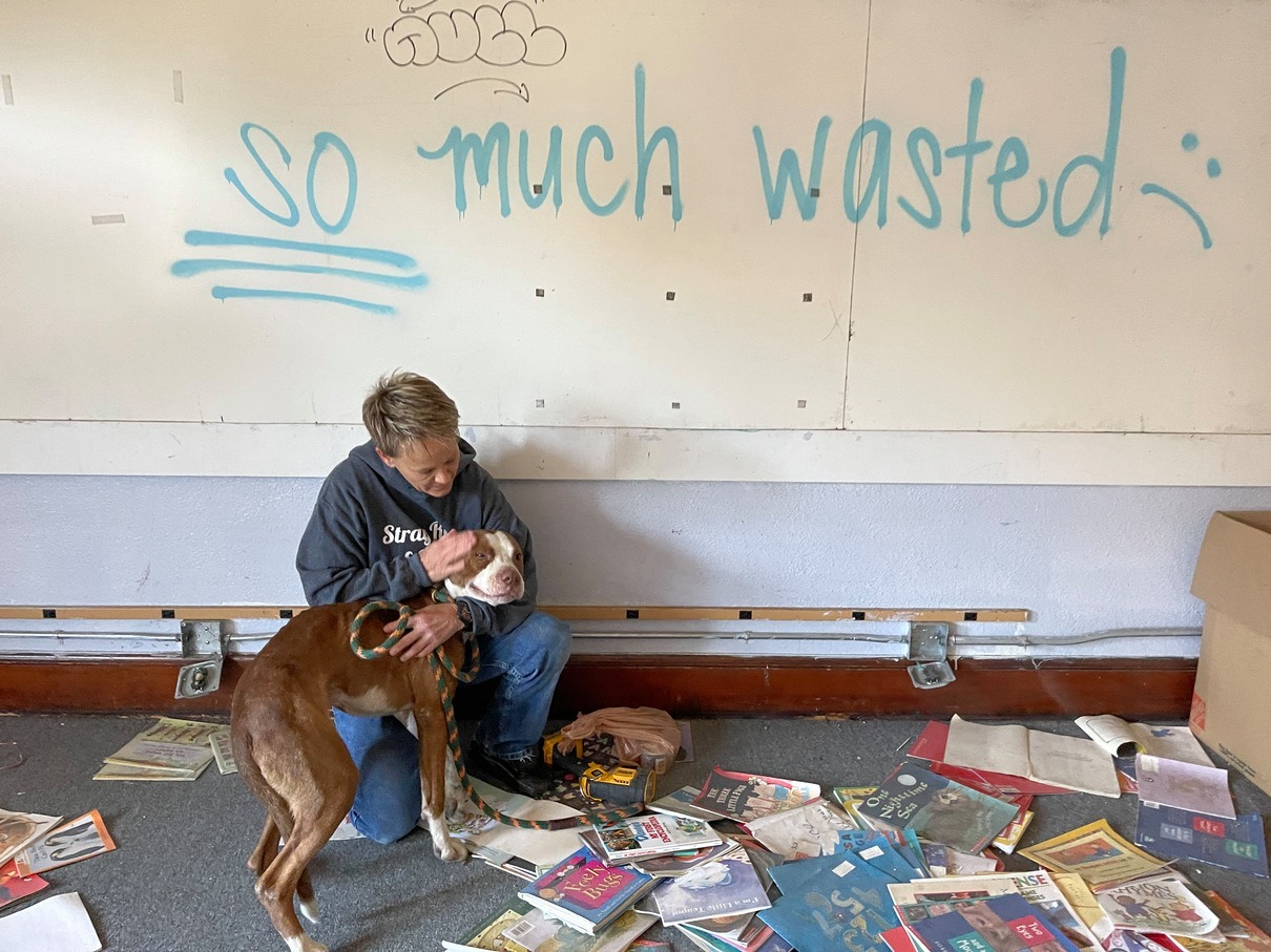 woman and abandoned pit bull