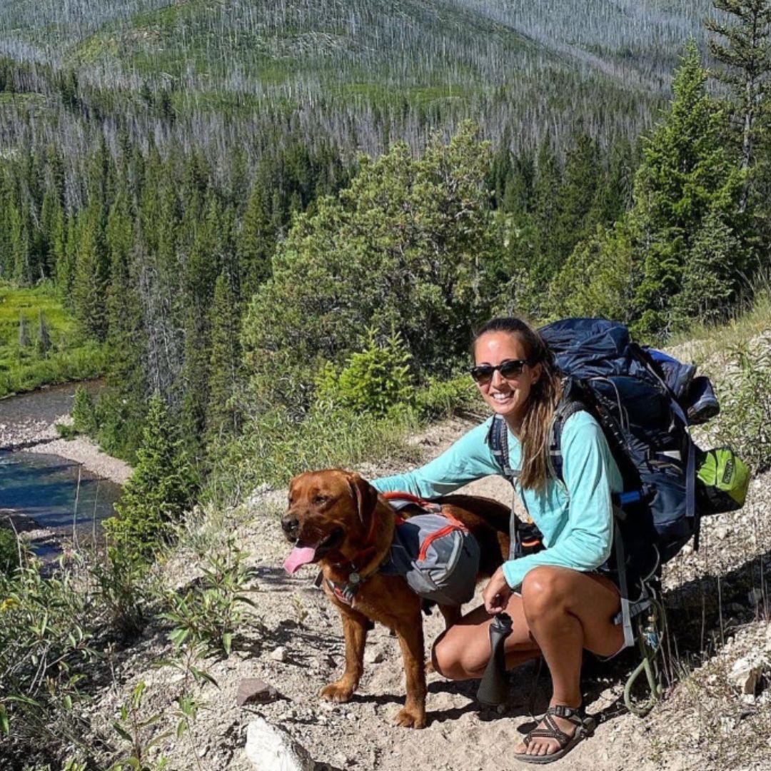 woman and brown dog