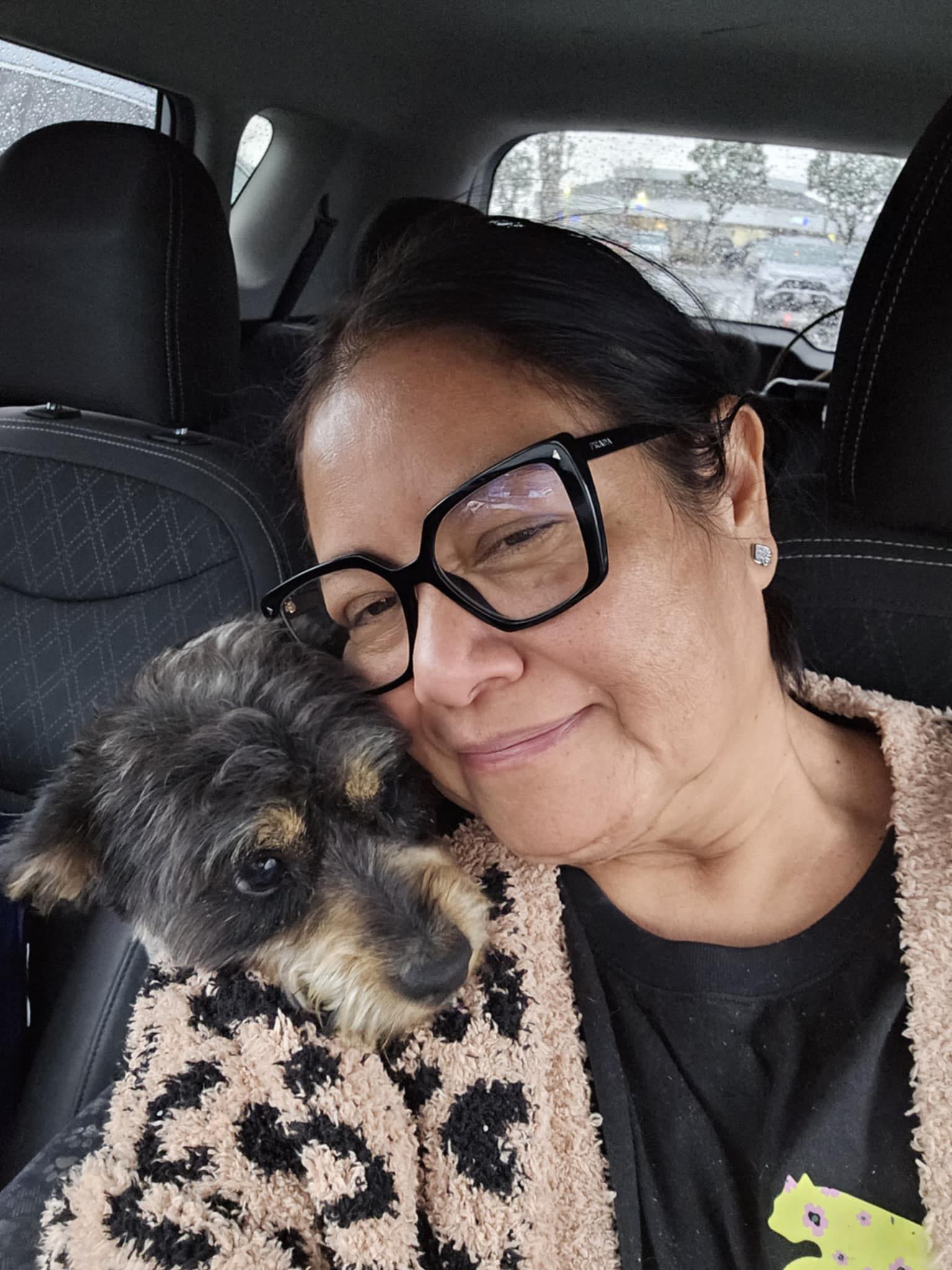 woman and dog in the car