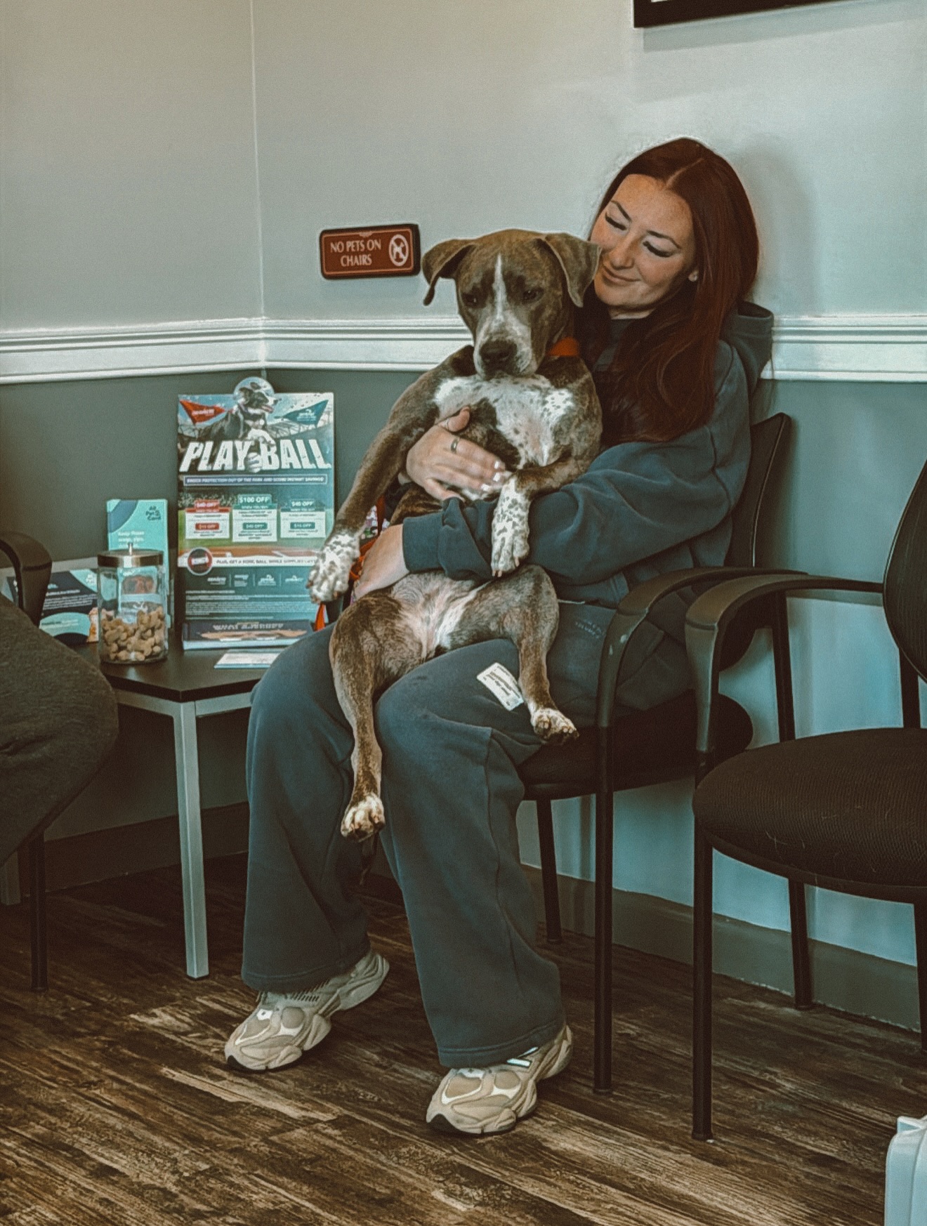 woman and dog sitting together